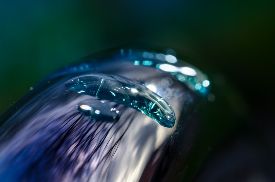 Water drop on faucet close up