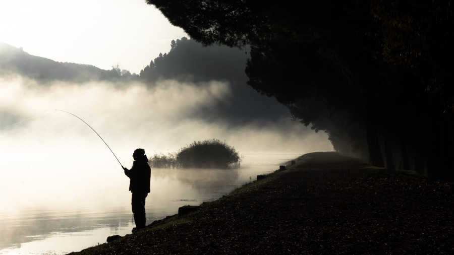 fisherman on the lake fishing. cloud  .